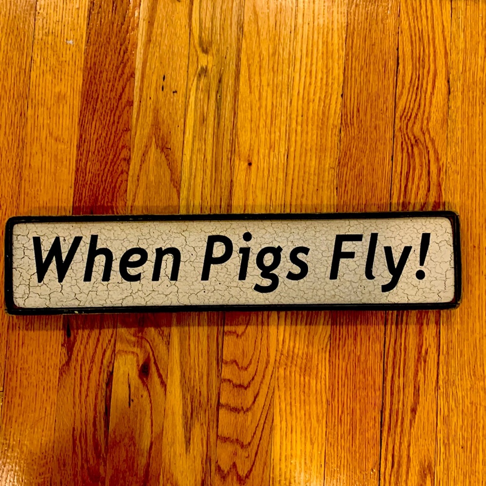 When Pigs Fly sign 18 1/2 “ by 4”. Distressed look. Like new.